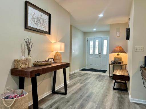 A view of the spacious entry and the tasteful decorating, it looks like a model.