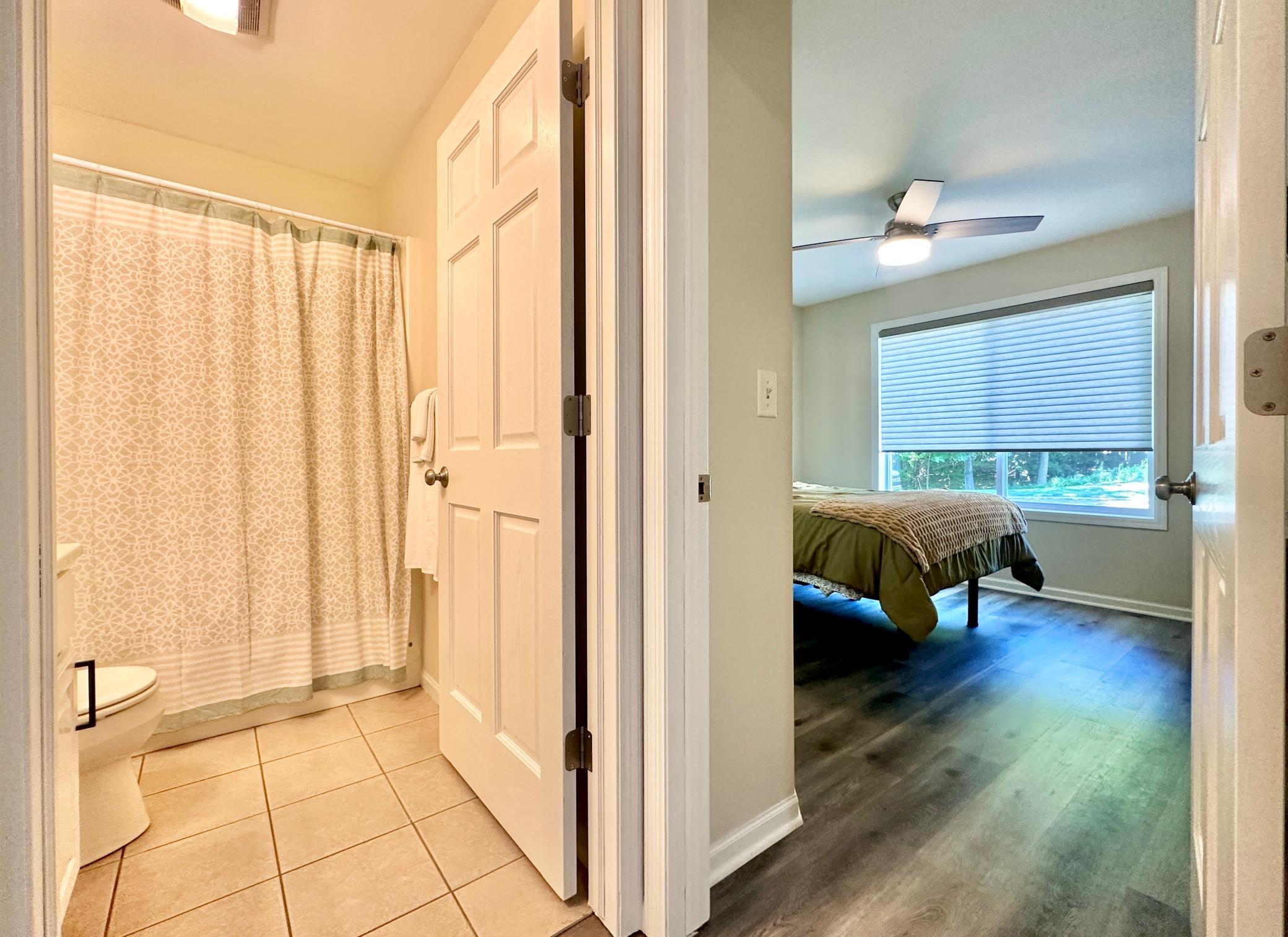Back to the front of the home just off the entry is the guest bath and first bedroom.