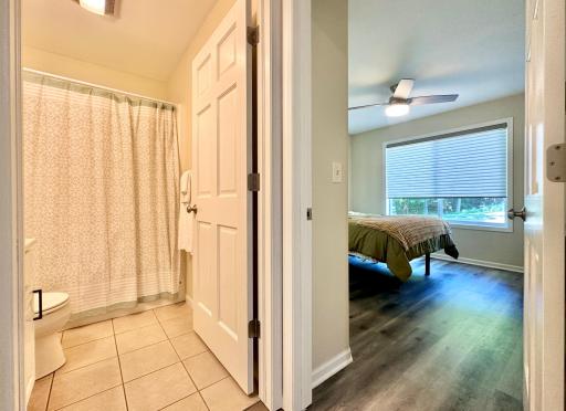 Back to the front of the home just off the entry is the guest bath and first bedroom.