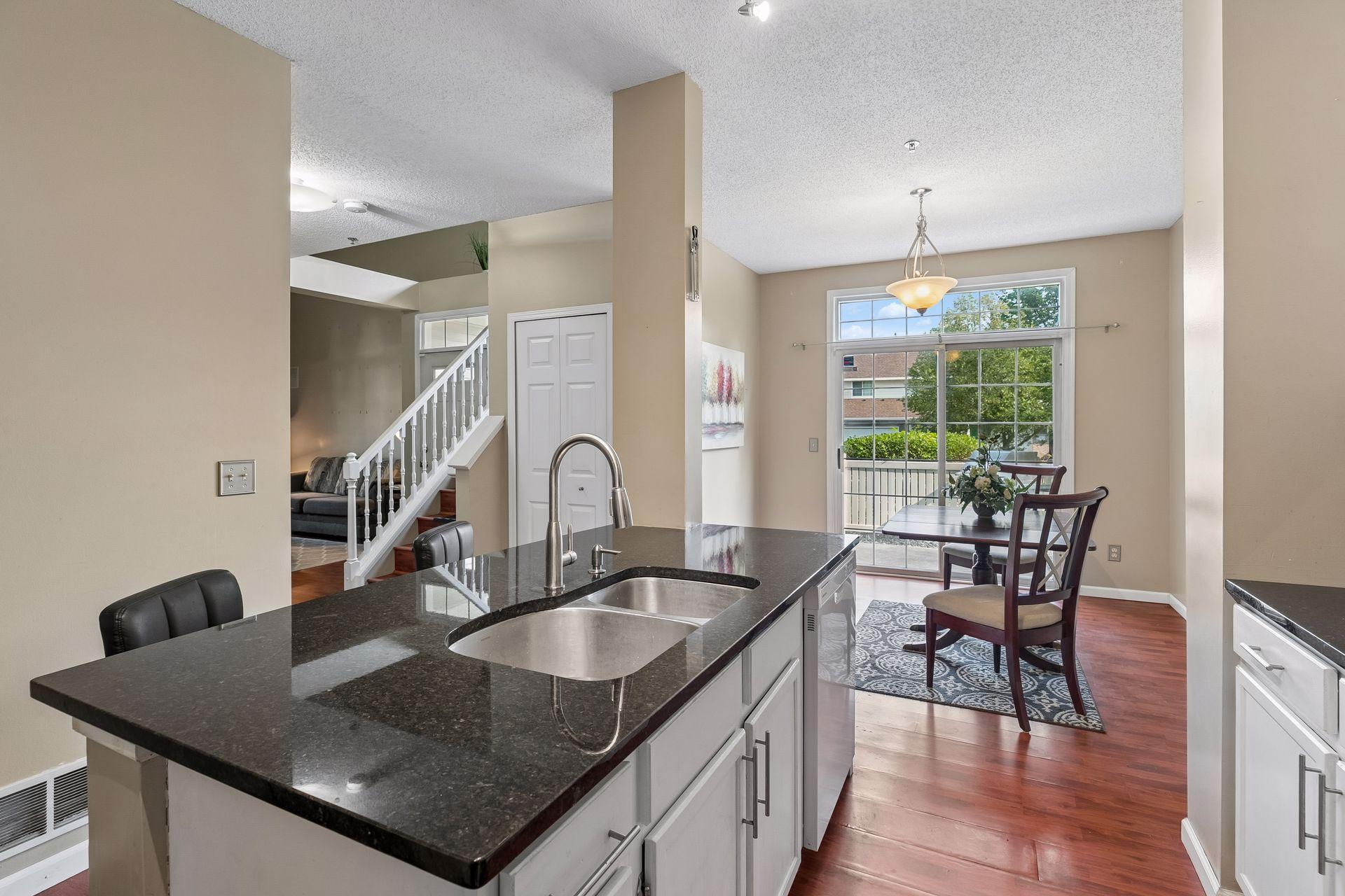The kitchen island features a sink for convenient clean-up.