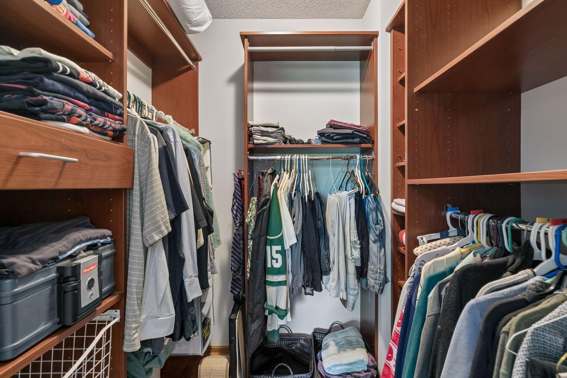 Large walk-in closet with built-in organizers.