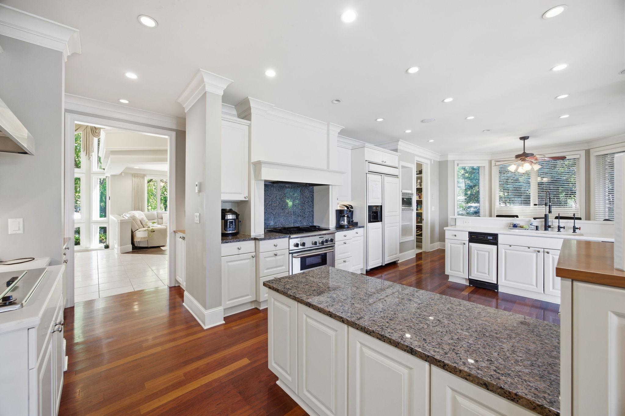 The beautifully appointed kitchen is a chef's dream, offering generous prep space, quality finishes, and an inviting layout