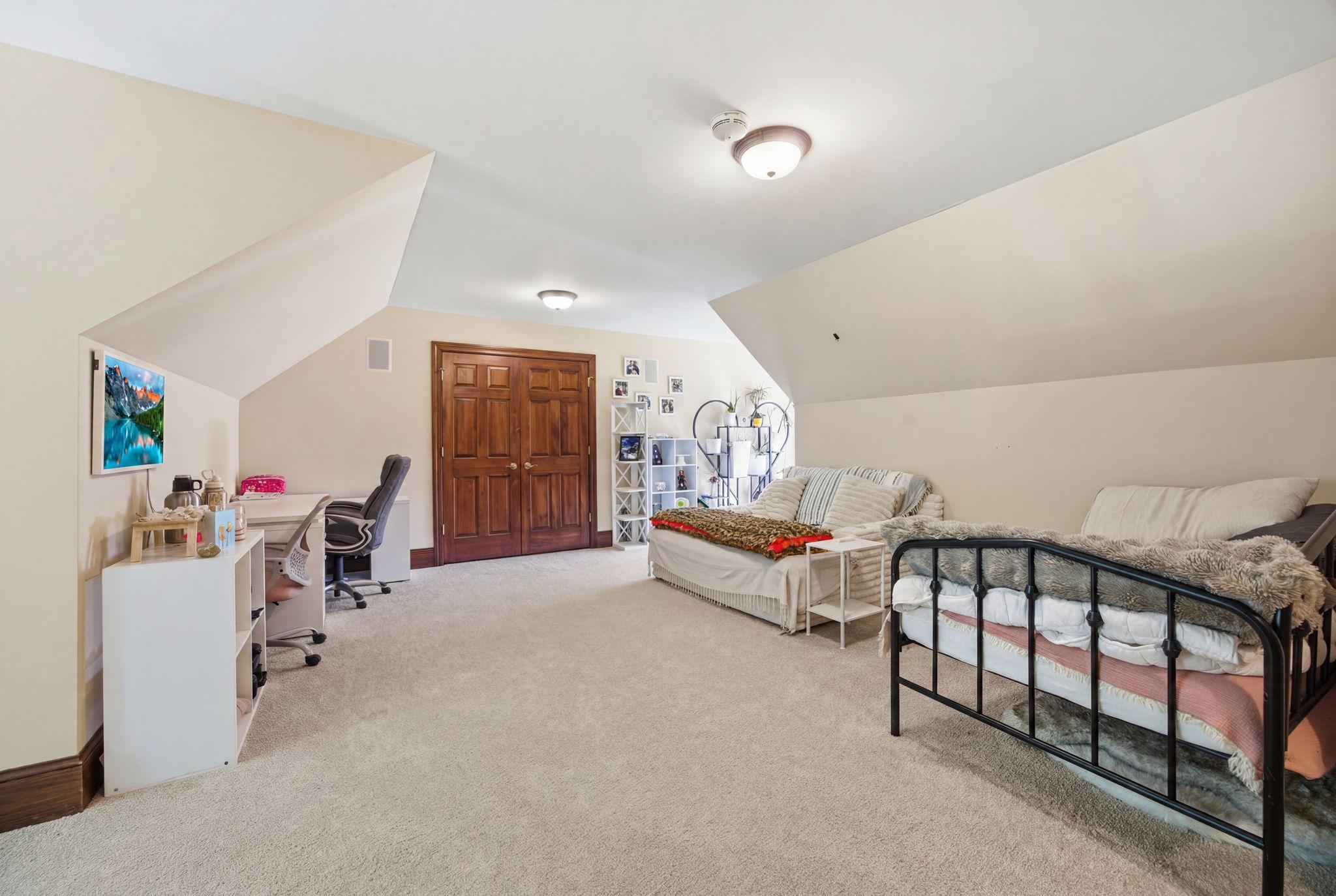 The spacious bonus room above the garage offers a private, flexible retreat—perfect for guests, multigenerational living, a media room, hobby space or a home office