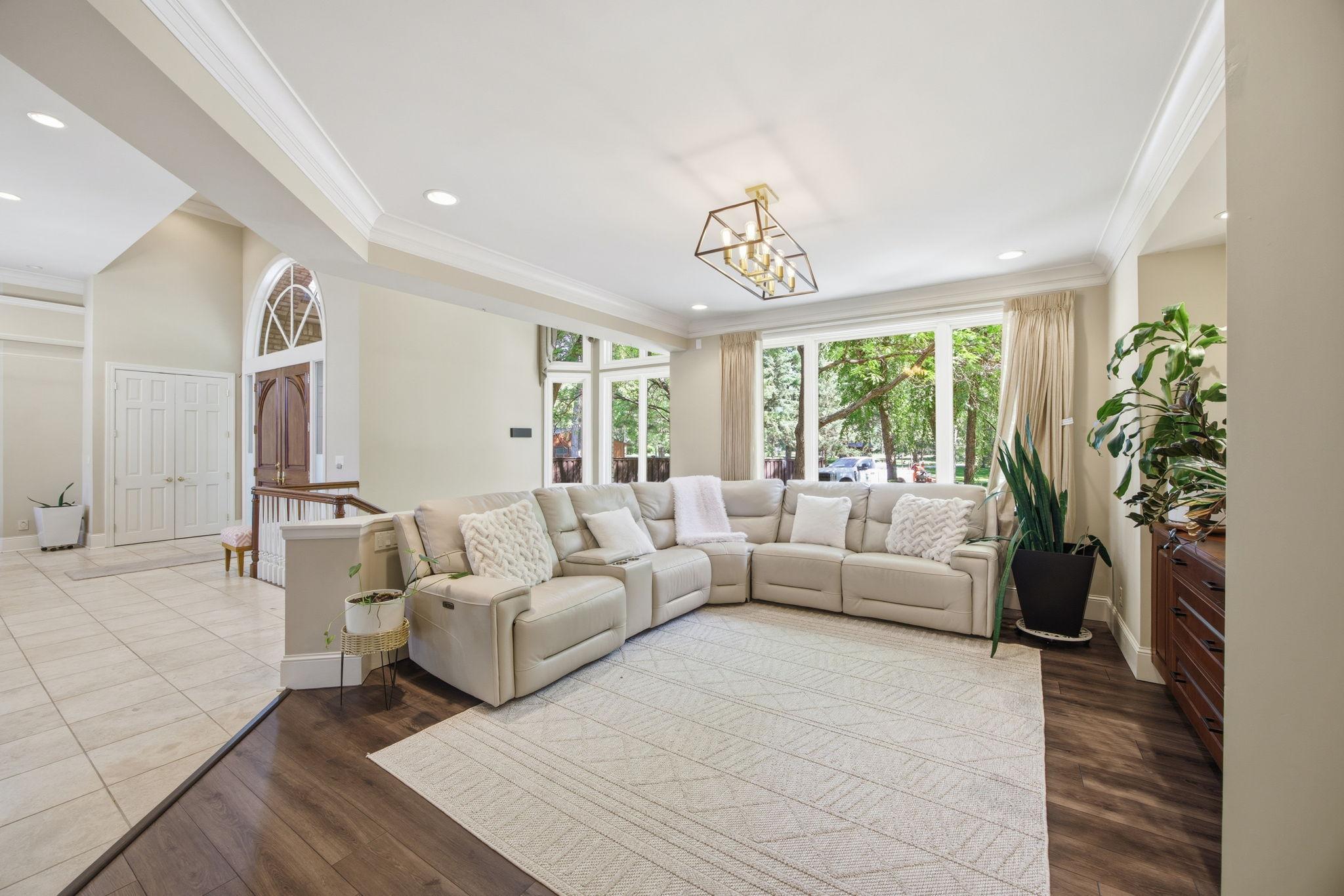 Just off the entry, a bright sitting room offers a comfortable place to welcome guests or unwind