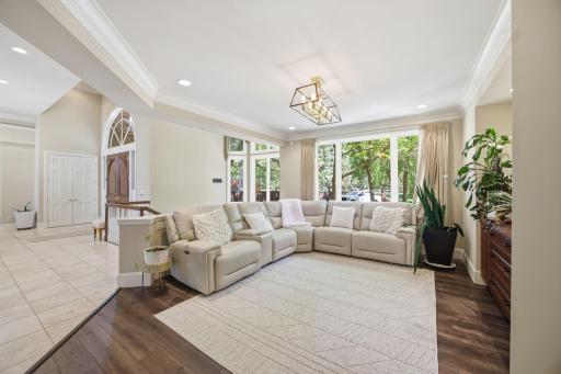 Just off the entry, a bright sitting room offers a comfortable place to welcome guests or unwind