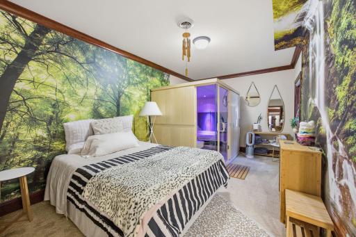 A private sauna creates a dedicated wellness retreat just steps from a comfortable guest space i n lower level bedroom 2