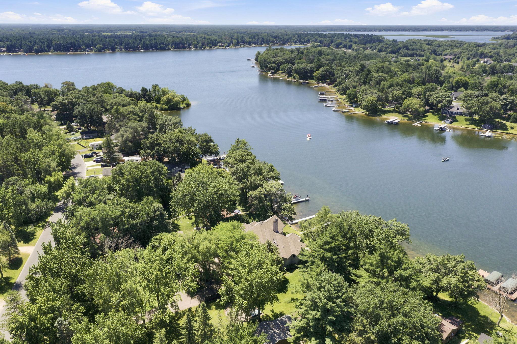 A breathtaking aerial captures the sparkling waters of Coon Lake and the natural beauty of the surrounding area