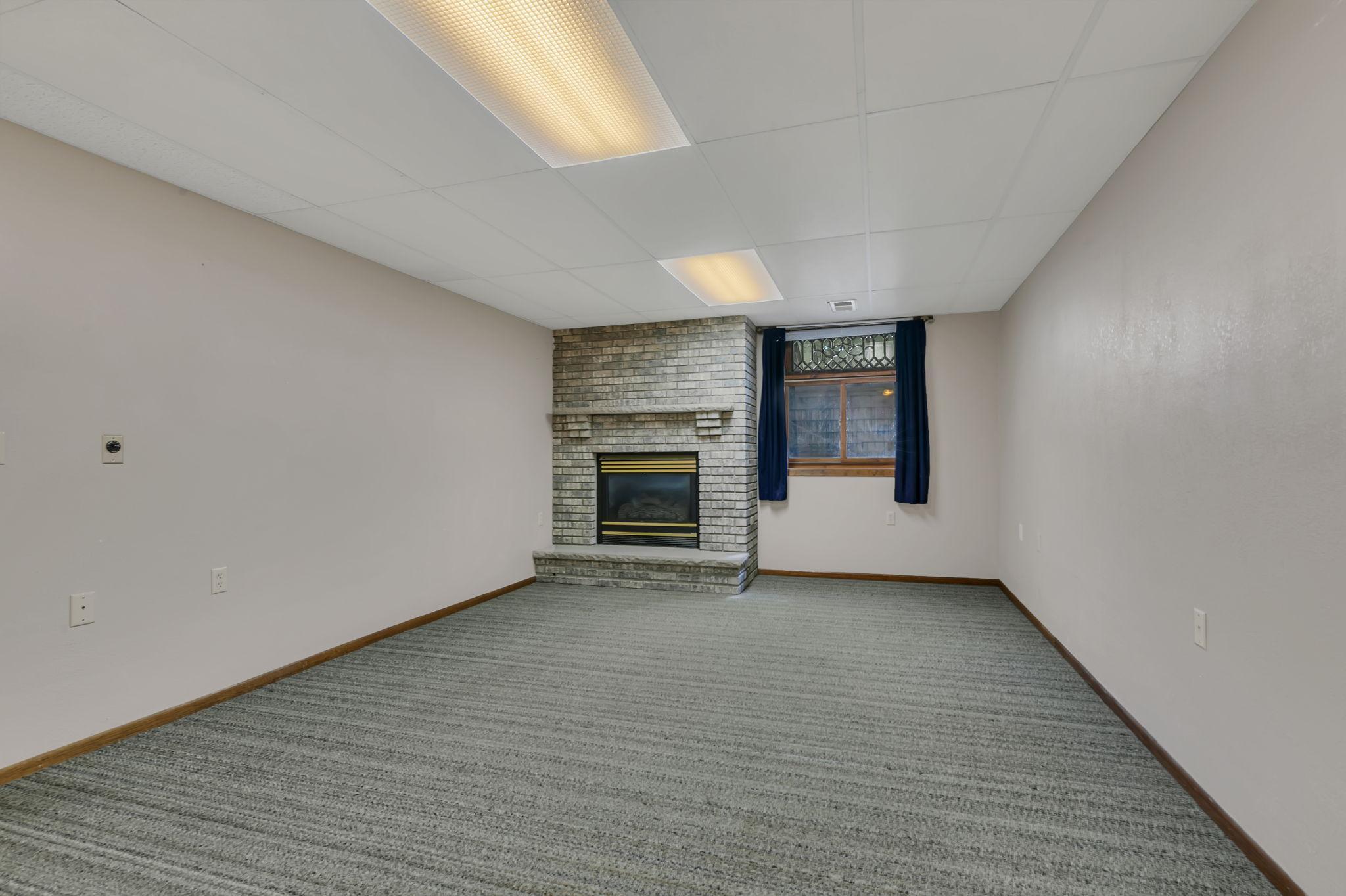 Lower Level Recreation Room with Gas Fireplace