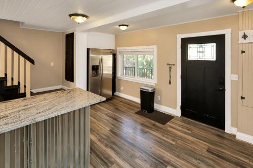 Beautifully updated flooring and door allowing lots of natural light.jpg