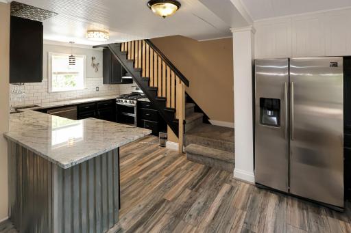 Nicely updated kitchen with granite countertops and stainless appliances.jpg