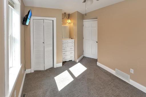 Main level bedroom with built in dresser.jpg