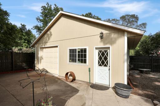 Backside of the 26x26 garage off the alley with a pass through door to the second garage.jpg