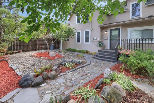Pavers leading through the landscape to the side door.jpg