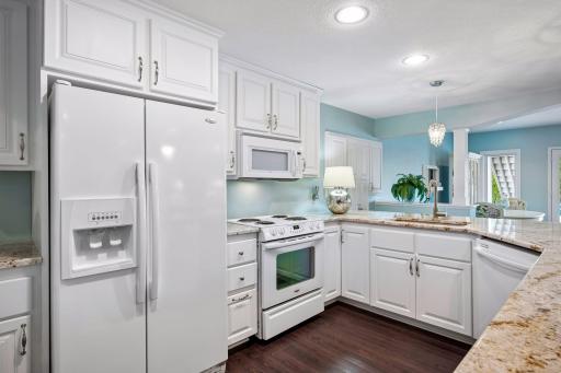 Kitchen includes refrigerator, oven, sink, and plenty of counterspace