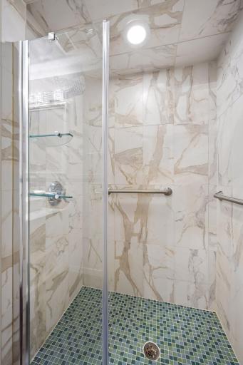 Walk-in shower in the lower level bathroom