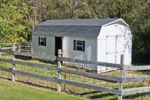 Outbuilding which could be used for pool equipment, horse necessities, or lawn/gardening supplies