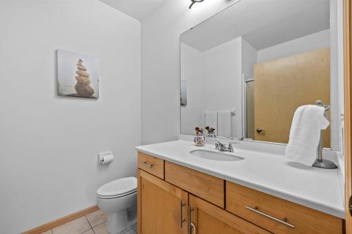 En-suite primary bath with a walk-in shower and vanity storage