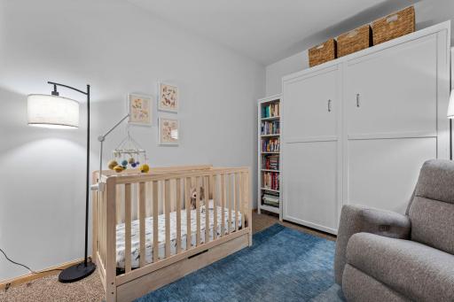 Flexible second bedroom, shown here as a nursery with the Murphy bed tucked away