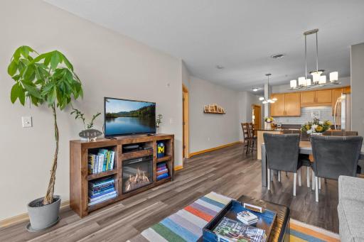 Open living area flows into the dining space and kitchen beyond