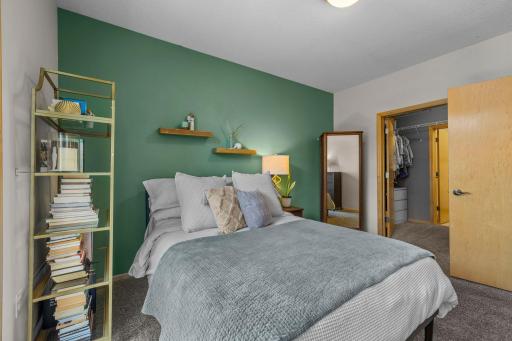 Primary bedroom with walk-in closet just off the sleeping area