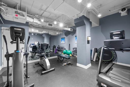 Building fitness center with cardio equipment and free weights