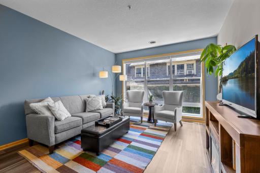 Spacious living room with new LVP flooring and room for a full seating and entertainment setup