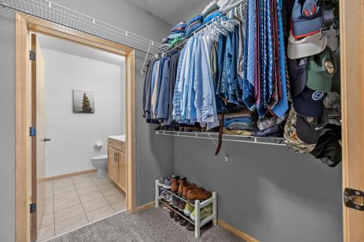 Ample closet storage for two, steps from the en-suite vanity