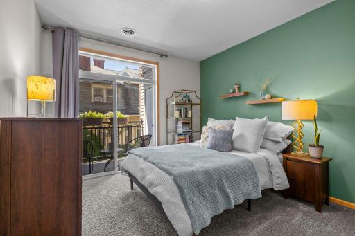 Primary bedroom with private balcony access