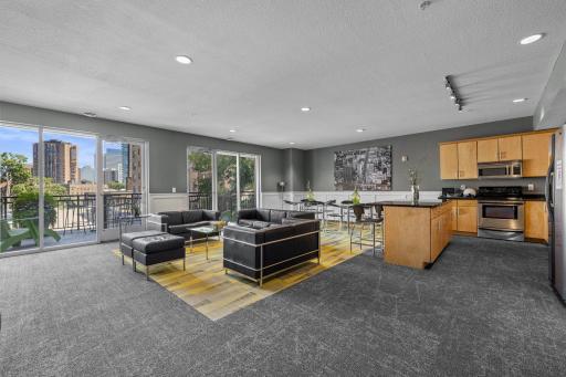 Community room with kitchenette and skyline views, great for entertaining
