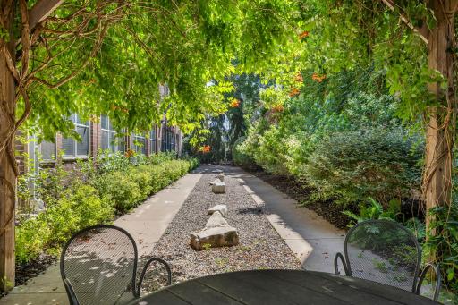 Zen garden pathway winds through the building's landscaped grounds