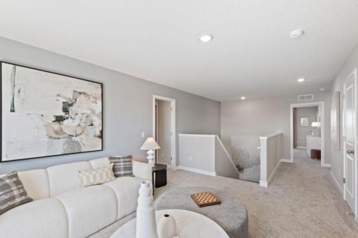 The upper level loft has enough room for the kids, the family, and all of your friends! Photo of model home, colors and finishes may vary.
