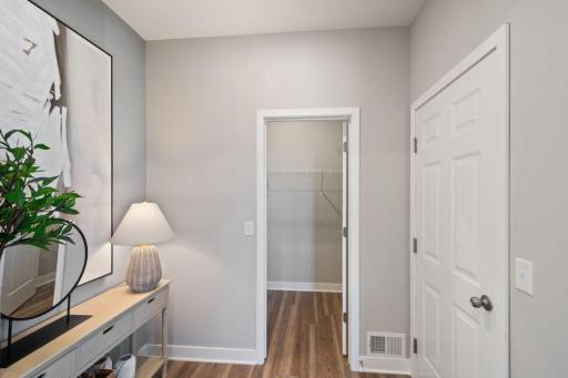 There is a nice mud room space and a walk-in closet at the garage entry to the home. Photo of model home, colors and finishes may vary.