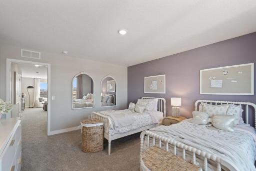 The third of four upper level bedrooms. Photo of model, colors and finishes may vary.