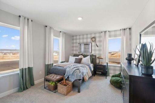 The fourth bedroom on the upper level. Photo of model, colors and finishes may vary.