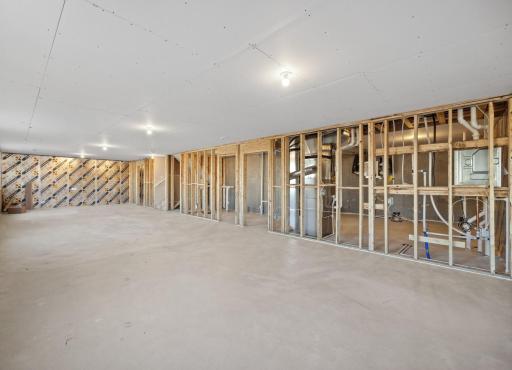 The unfinished lower level adds a future bedroom, bathroom, family room, and flex room. Photo of model home, colors and finishes may vary.
