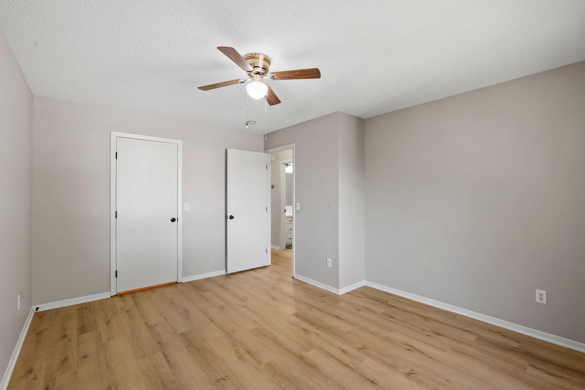 Alternate view of the bedroom with closet and neutral finishes.