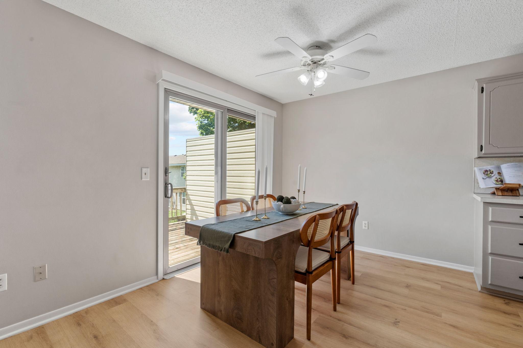 Dining area with backyard views and sliding glass door.