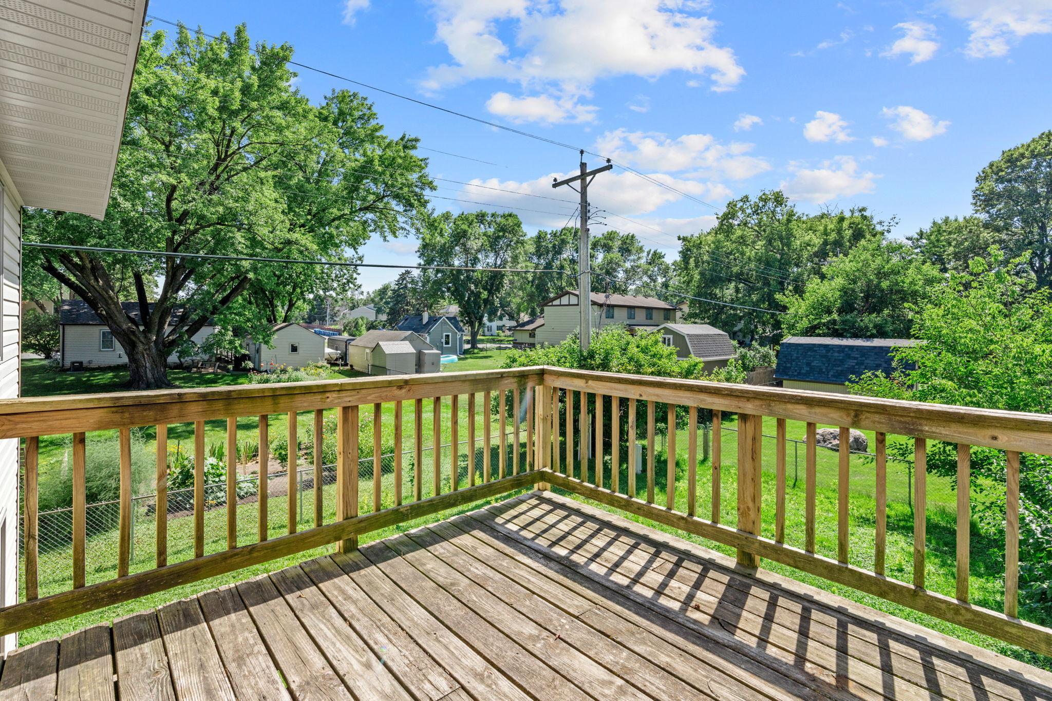 Backyard deck with space for outdoor seating.