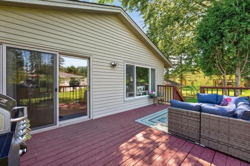 Sliding glass doors provide easy access from the home to the outdoor living space.