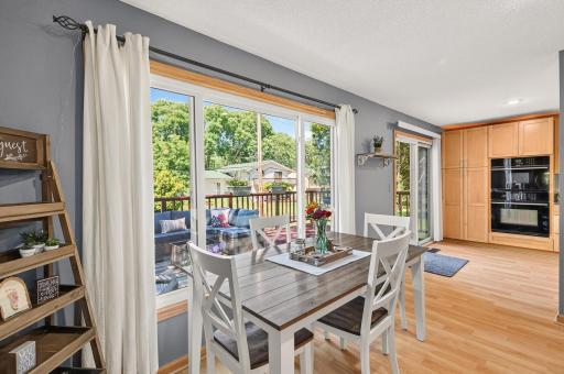 Large windows brighten the dining space and provide peaceful backyard views.