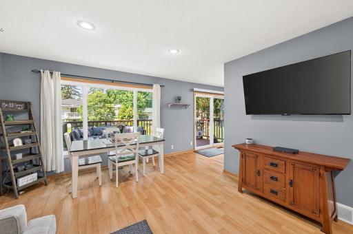 Enjoy meals with family and friends in the bright dining area, complete with a large picture window overlooking the backyard and direct access to the deck for easy indoor-outdoor entertaining.