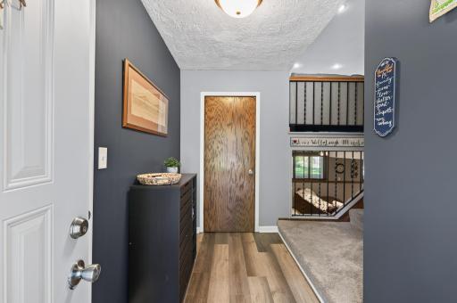 Step inside to a bright, welcoming foyer with updated flooring, a large entry closet, and an easy-flowing layout.