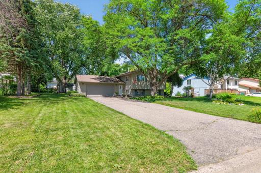 The expansive front yard creates a welcoming first impression and a peaceful neighborhood setting that you’ll love coming home to.
