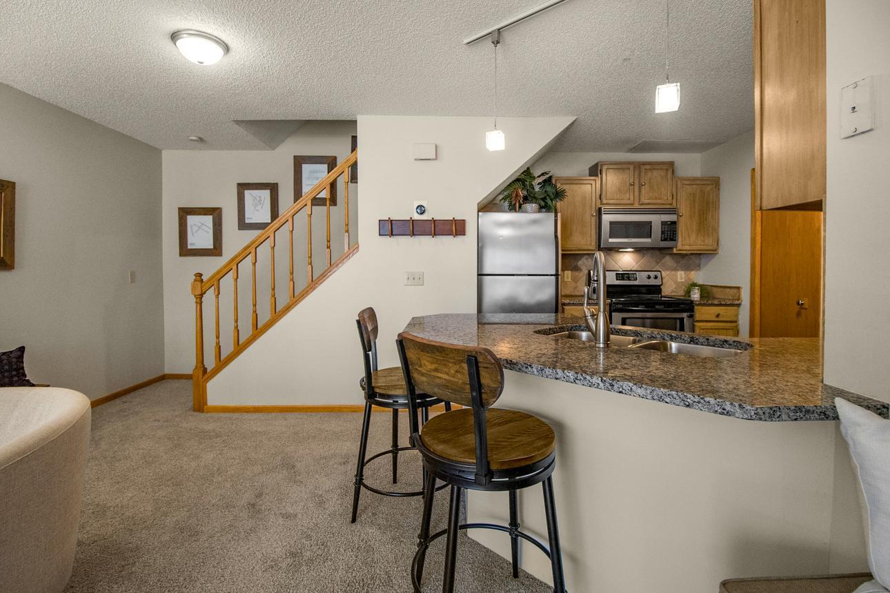Breakfast bar and added seating plus counter space. Plenty of room for a dining table if desired