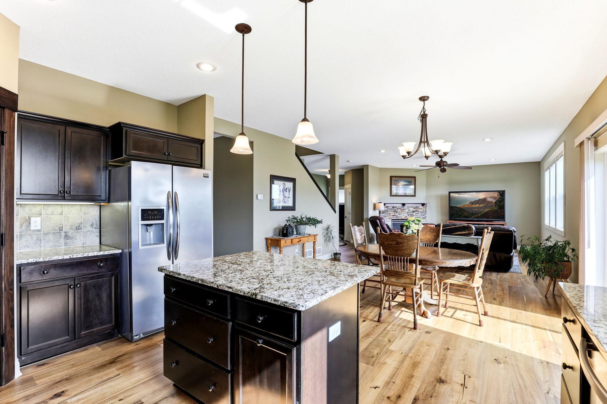 Functional kitchen island seamlessly connected to dining area for effortless entertaining.