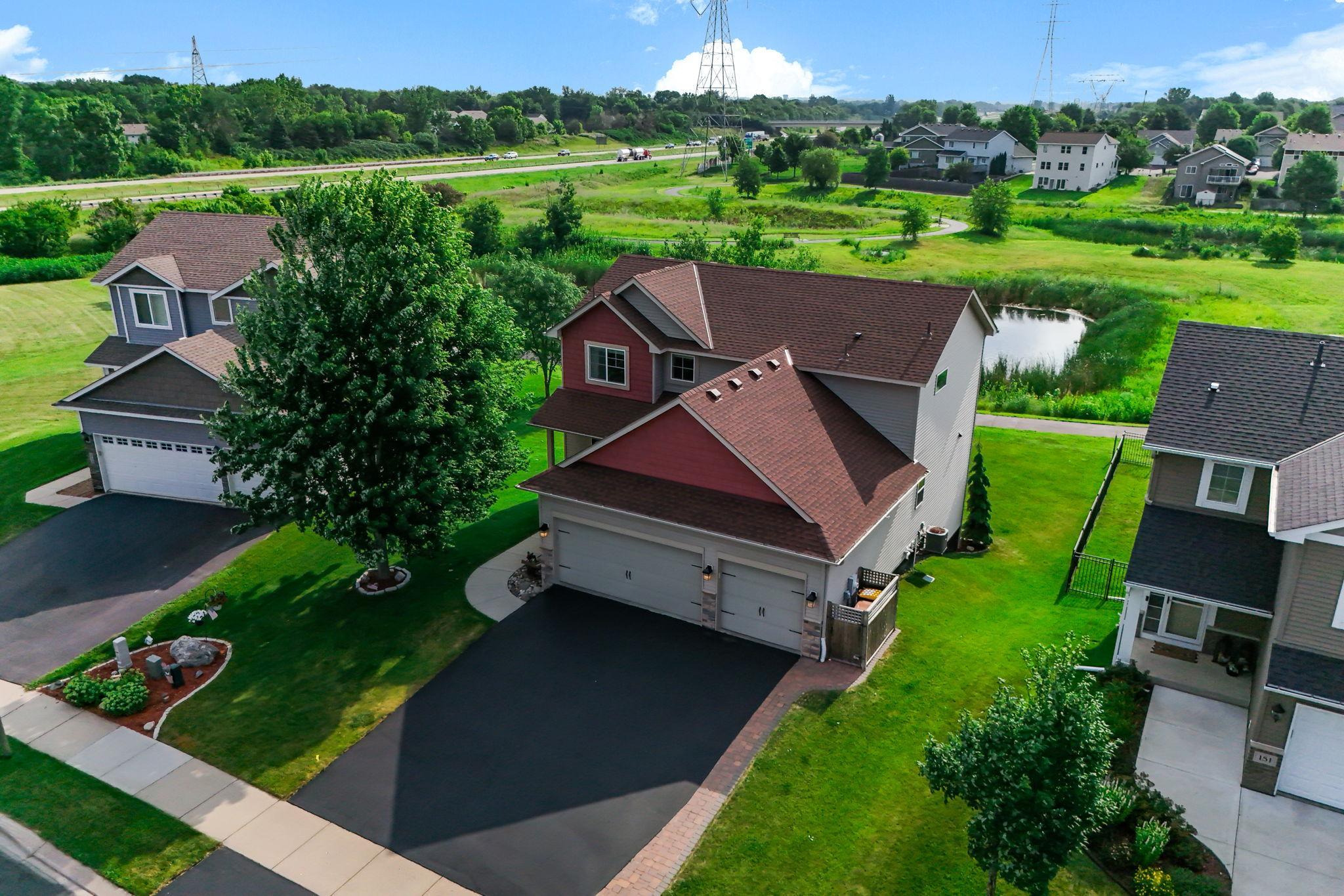 Beautiful two-story home featuring fantastic curb appeal, insulated 3-car garage, and a scenic rear pond view.