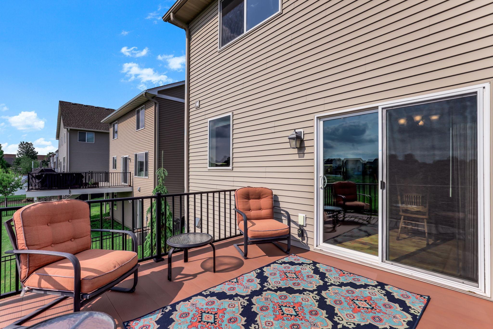 Elevated deck with maintenance-free composite decking and direct sliding glass door access from dining area.