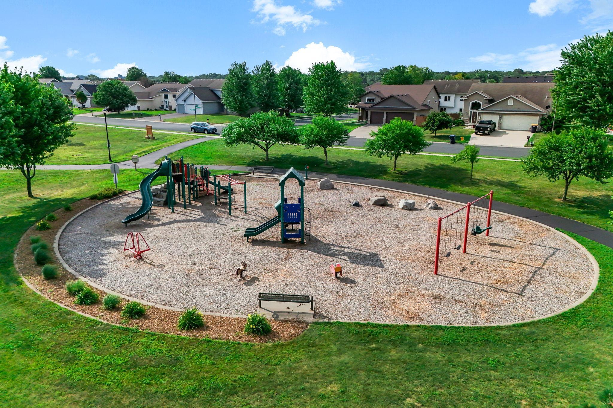 Neighborhood park and playground connected by nearby community walking paths.