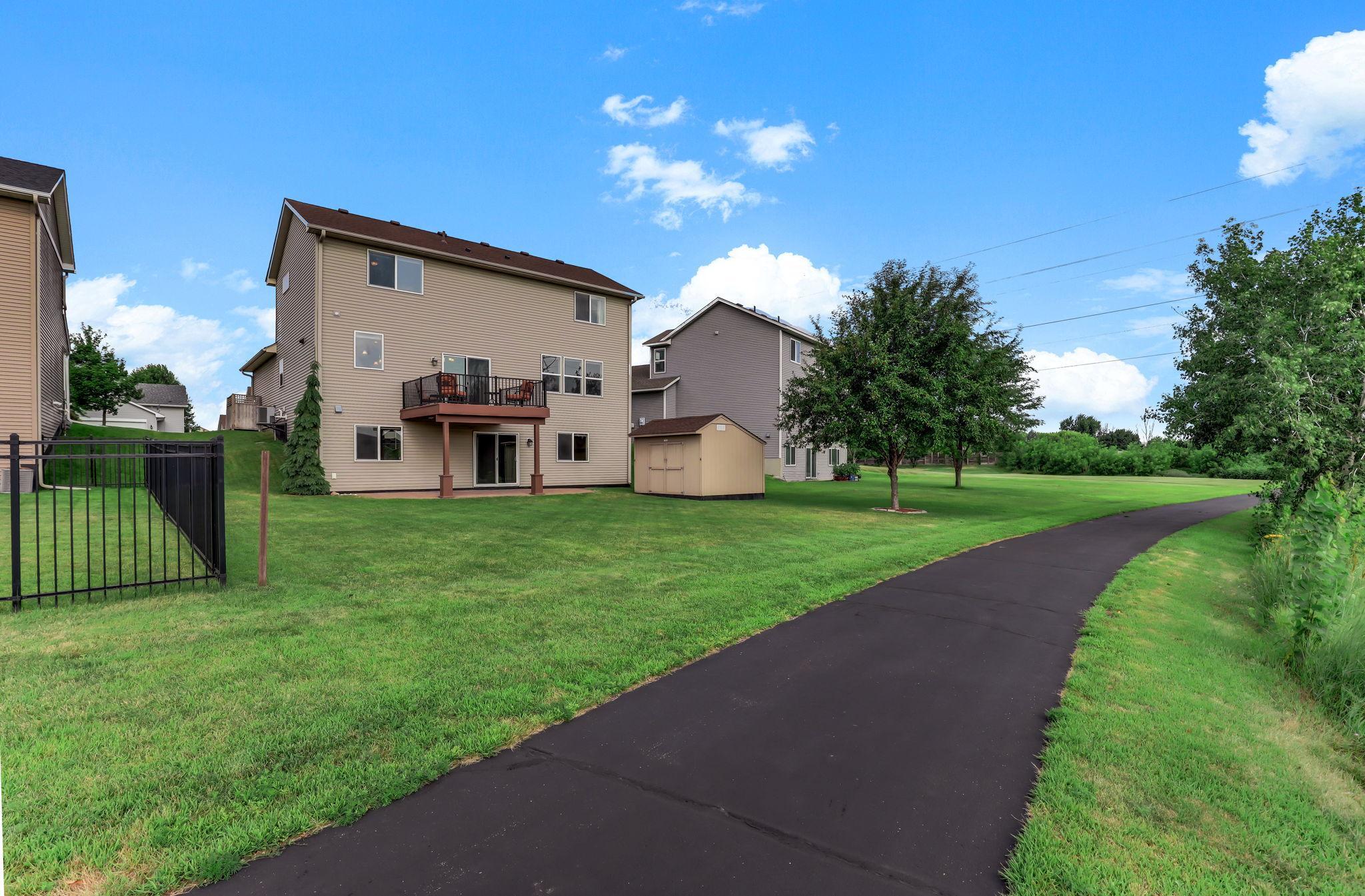 Prime location backing directly to neighborhood walking paths, green space, and scenic nature views.