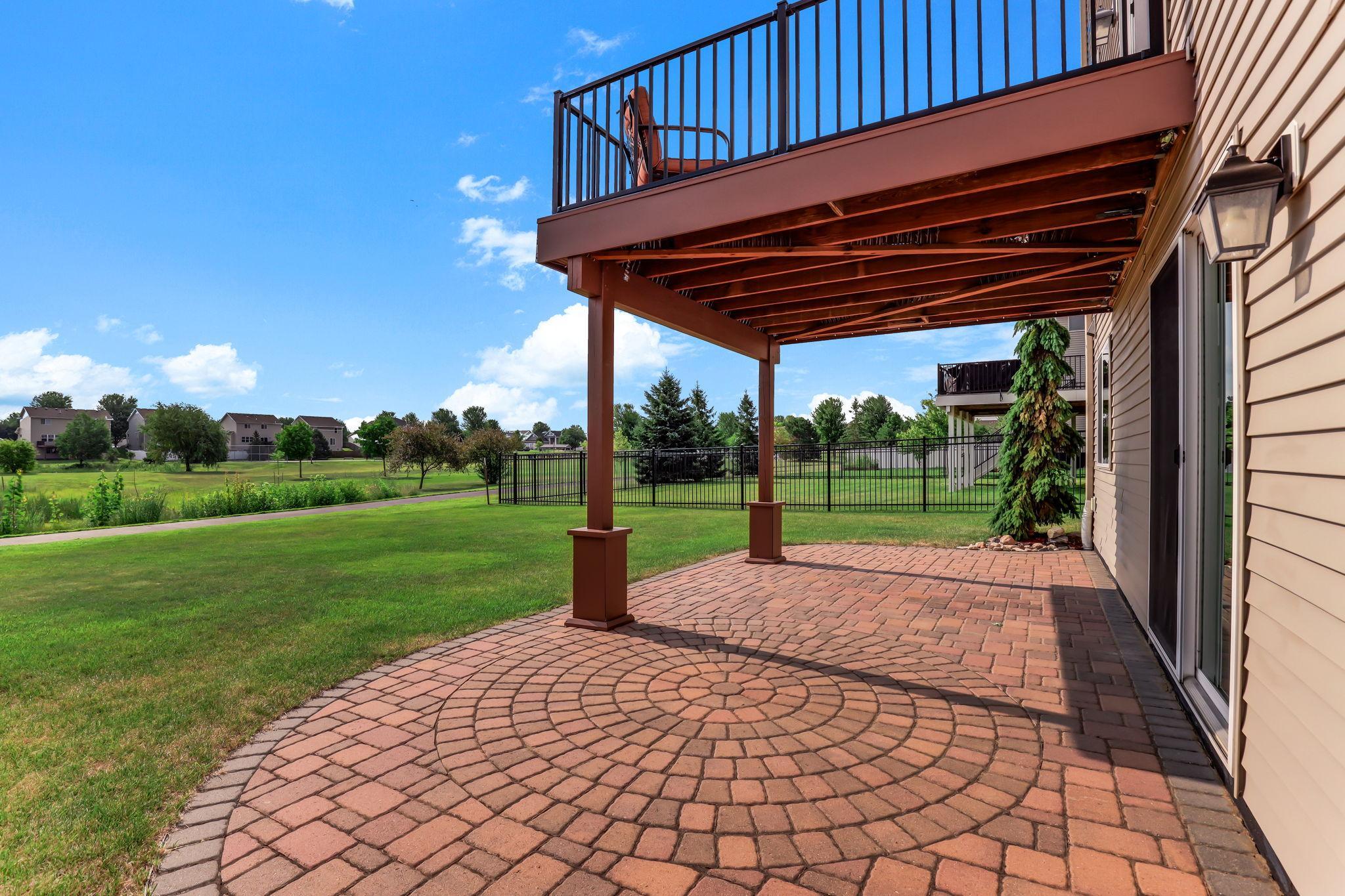 Covered paver patio sitting beneath the maintenance-free aluminum patio deck—ideal for shade and relaxing.